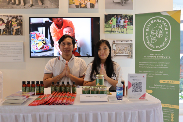 Gus Adit (left) and Ari (right) are posing behind their products.